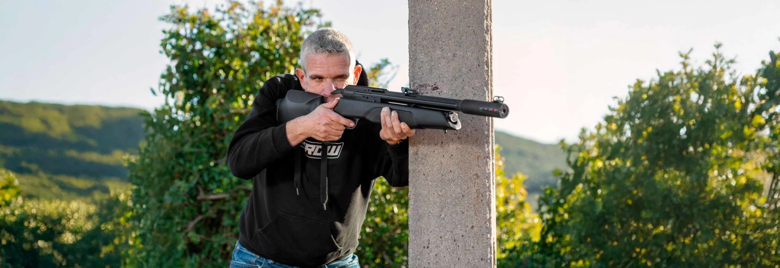 Gamo Official Action Campaign 2025 Adult shooter holding a Gamo air rifle in an official Gamo action campaign