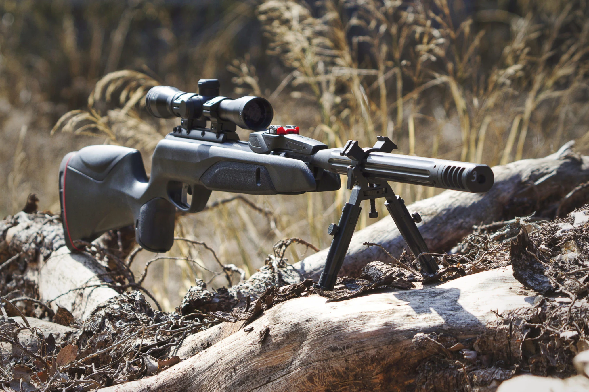 Gamo Official Field Story Gamo air rifle and branded cap in an official outdoor campaign image